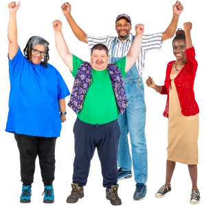 Four people standing together with one arm raised in celebration, smiling and looking happy.