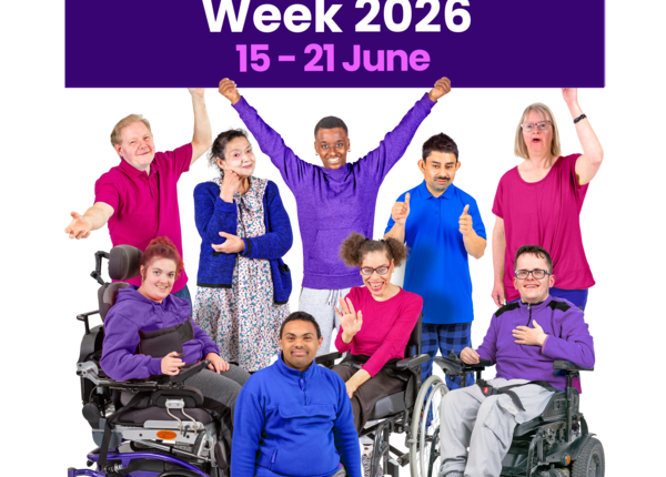 Group celebrating Learning Disability Week 2026 with a purple sign.