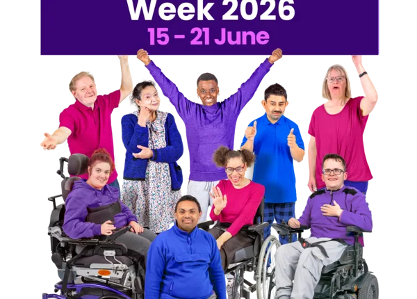 Group celebrating Learning Disability Week 2026 with a purple sign.